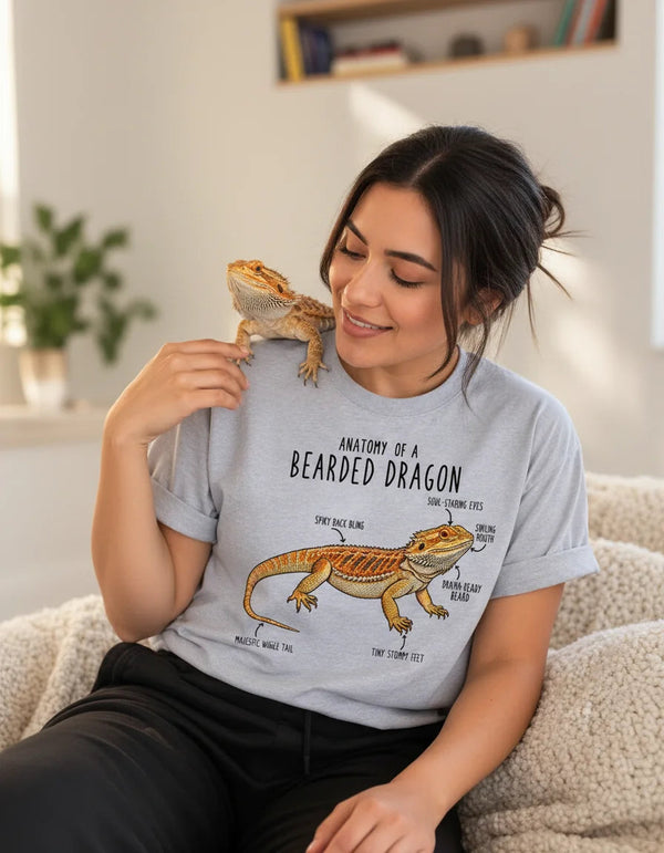 Woman wearing the Anatomy of a Bearded Dragon T-shirt with her pet bearded dragon on her shoulder