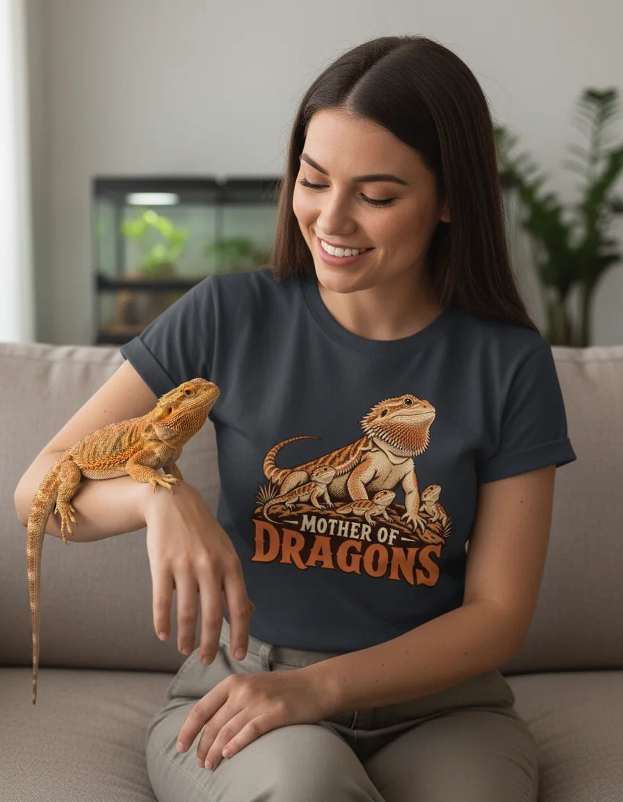 Woman wearing the Mother of Dragons bearded dragon mom t-shirt with her pet bearded dragon on her arm